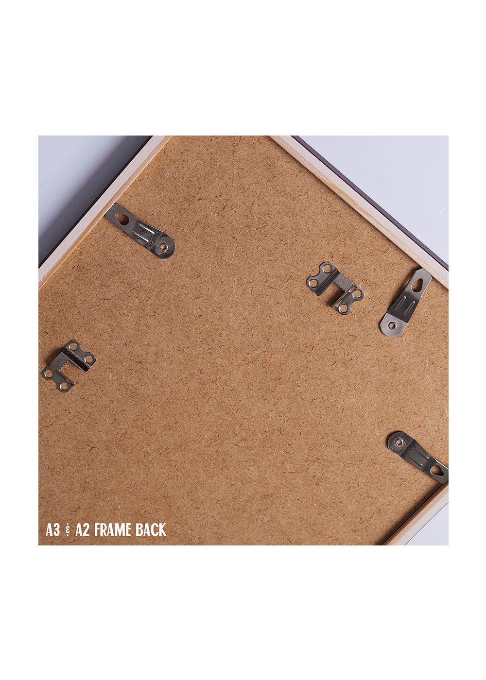 Back of a frame with metal brackets and cork surface, labeled A3/A2 frame back.