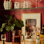 Late_Afternoon_Oro_Jug_and_Blanco_Glasses_on_Shelf