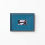 An A5 petrol blue frame from Late afternoon with a blue a5 Instax mini mount of an ultrasounds scan