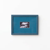 An A5 petrol blue frame from Late afternoon with a blue a5 Instax mini mount of an ultrasounds scan