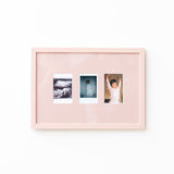 A light pink double-photo frame with a glossy finish, displaying two sample photographs side-by-side against a clean white background.