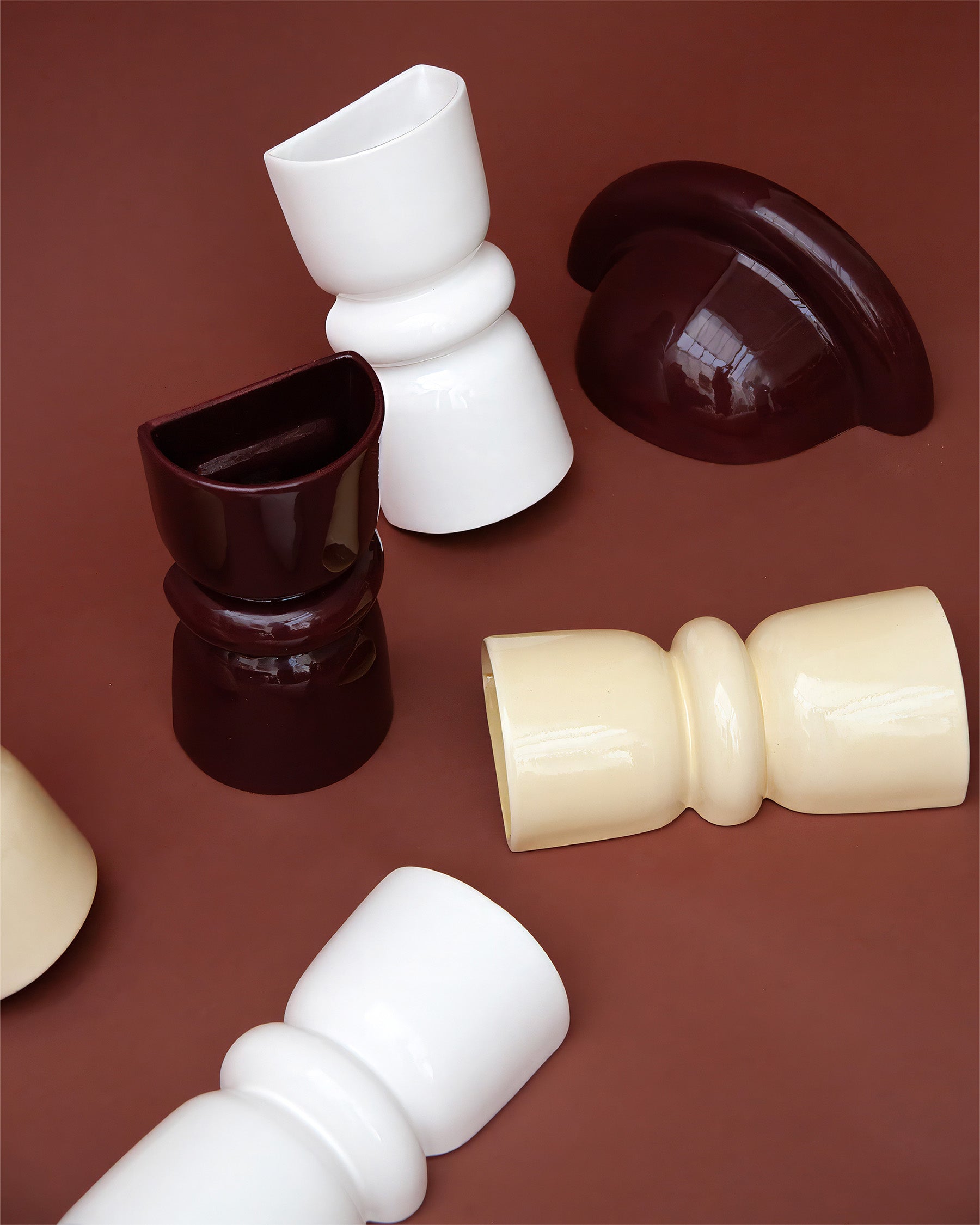 Late Afternoon Lighting Collection of Up and Down lighter Ceramic Sconce Wall Lights on a brown background