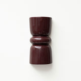 Late Afternoon Lighting Burgundy Up and Down lighter Ceramic Wall Light hung on a white wall