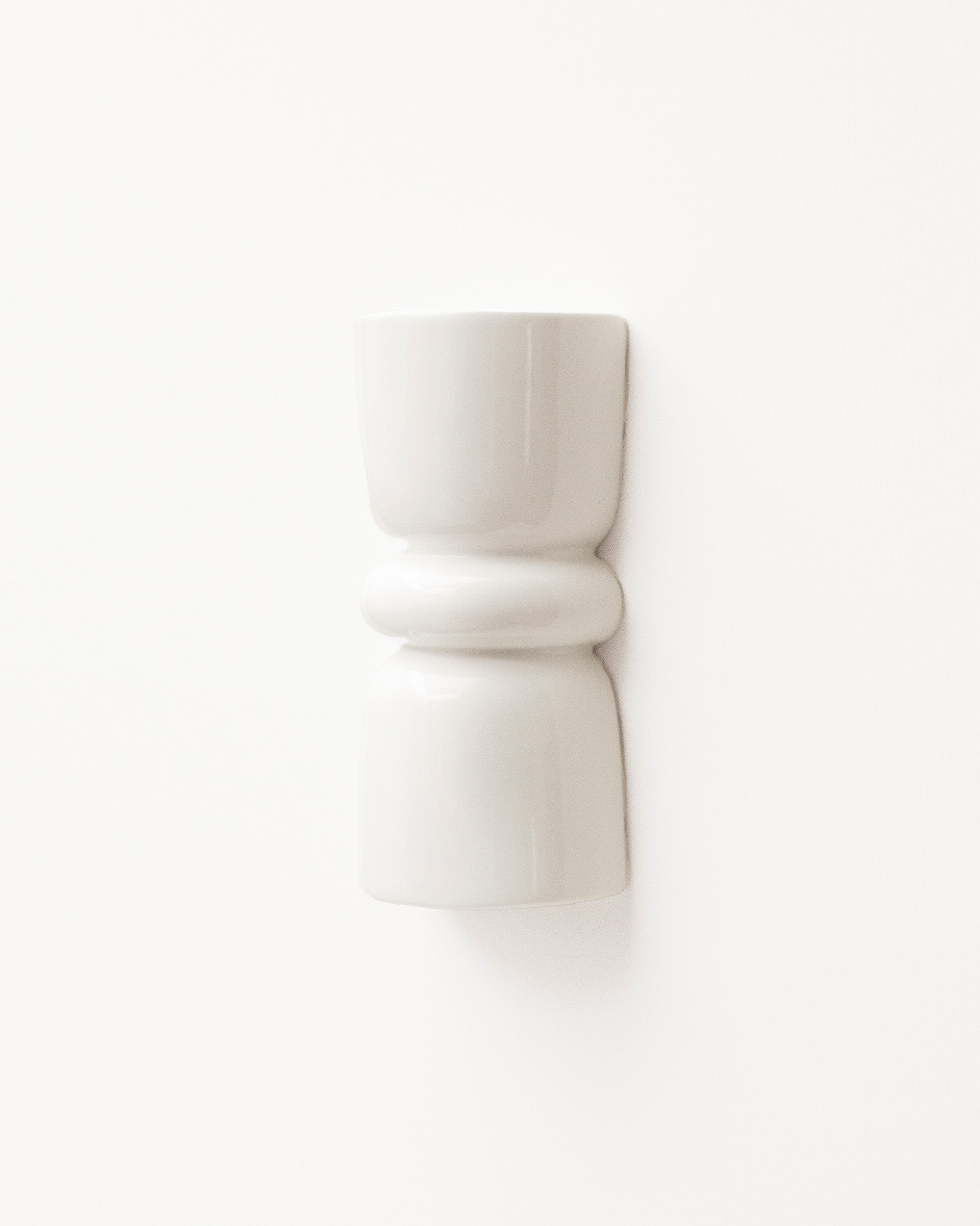 Late Afternoon Lighting White Up and Down lighter Ceramic Wall Light on a white wall