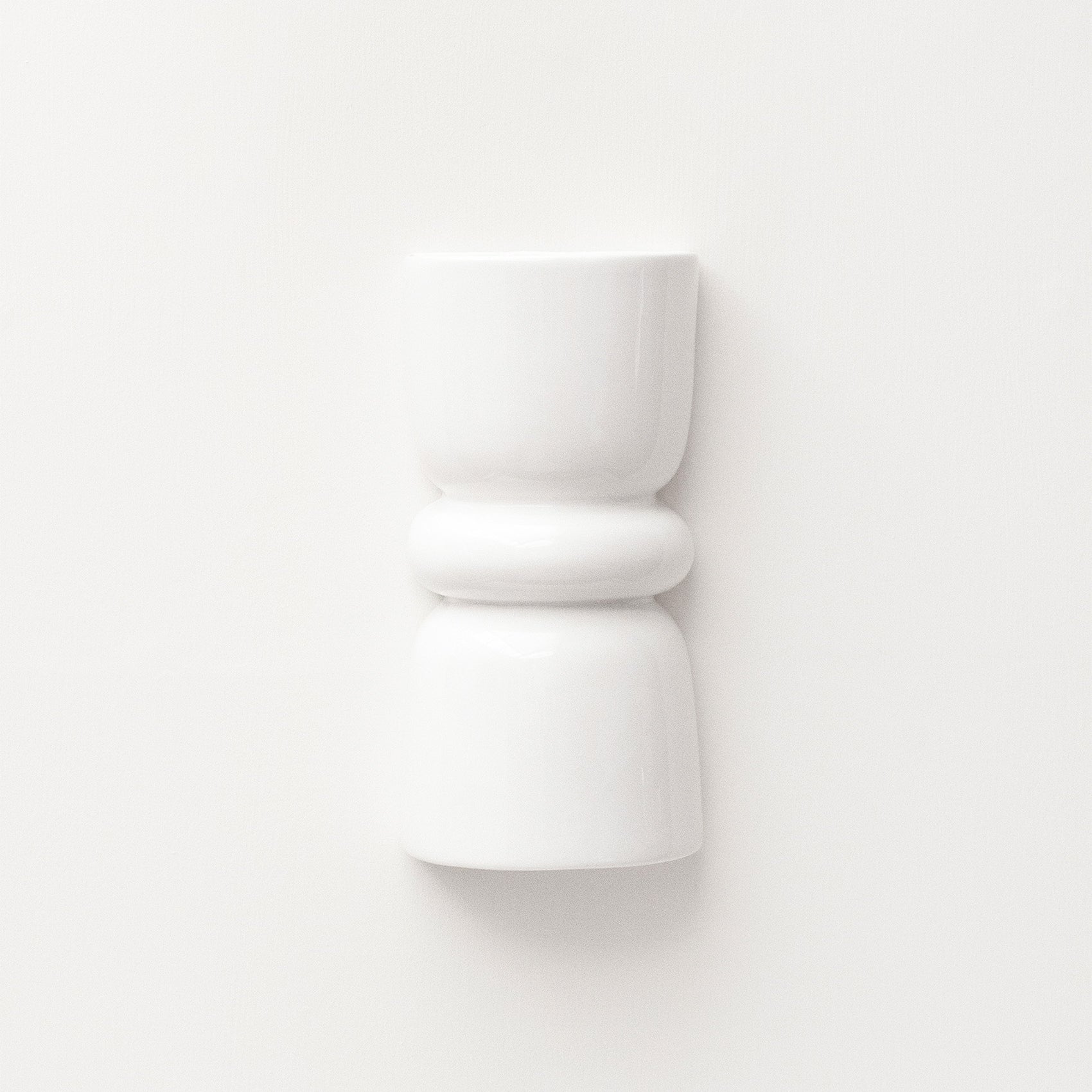 Late Afternoon Lighting White Up and Down lighter Ceramic Wall Light on a white wall