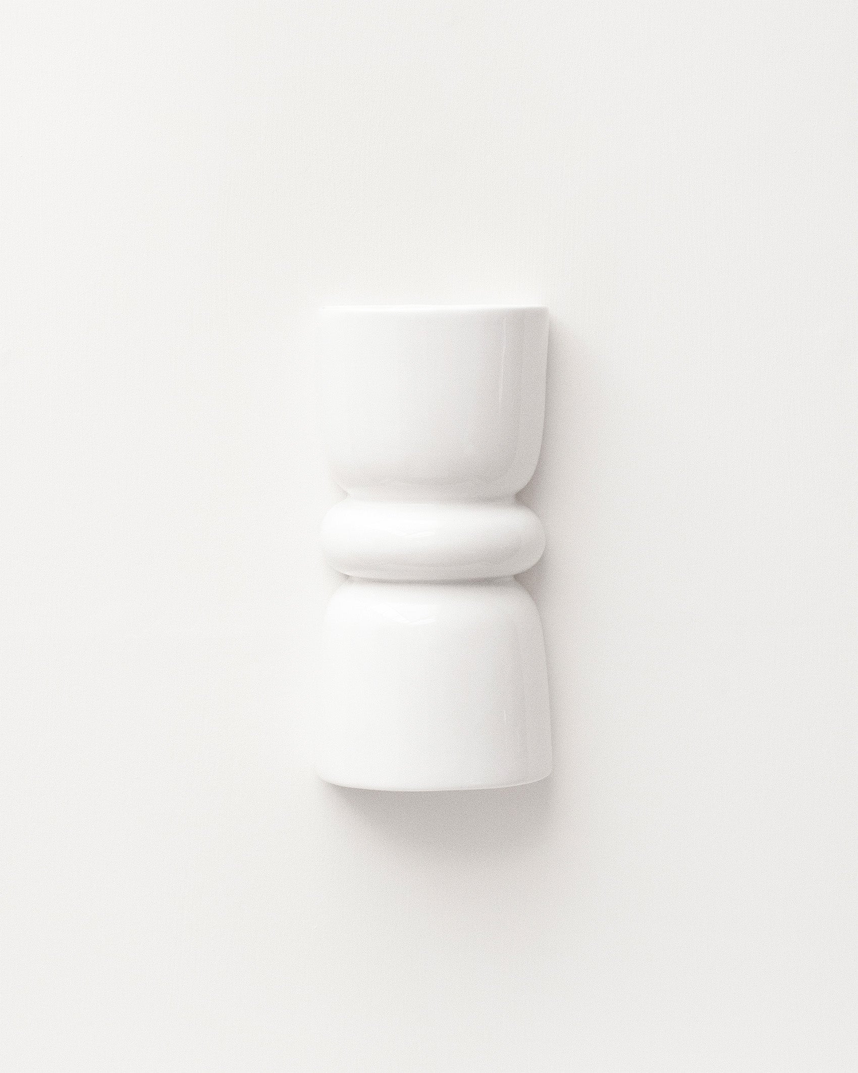 Late Afternoon Lighting White Up and Down lighter Ceramic Wall Light on a white wall