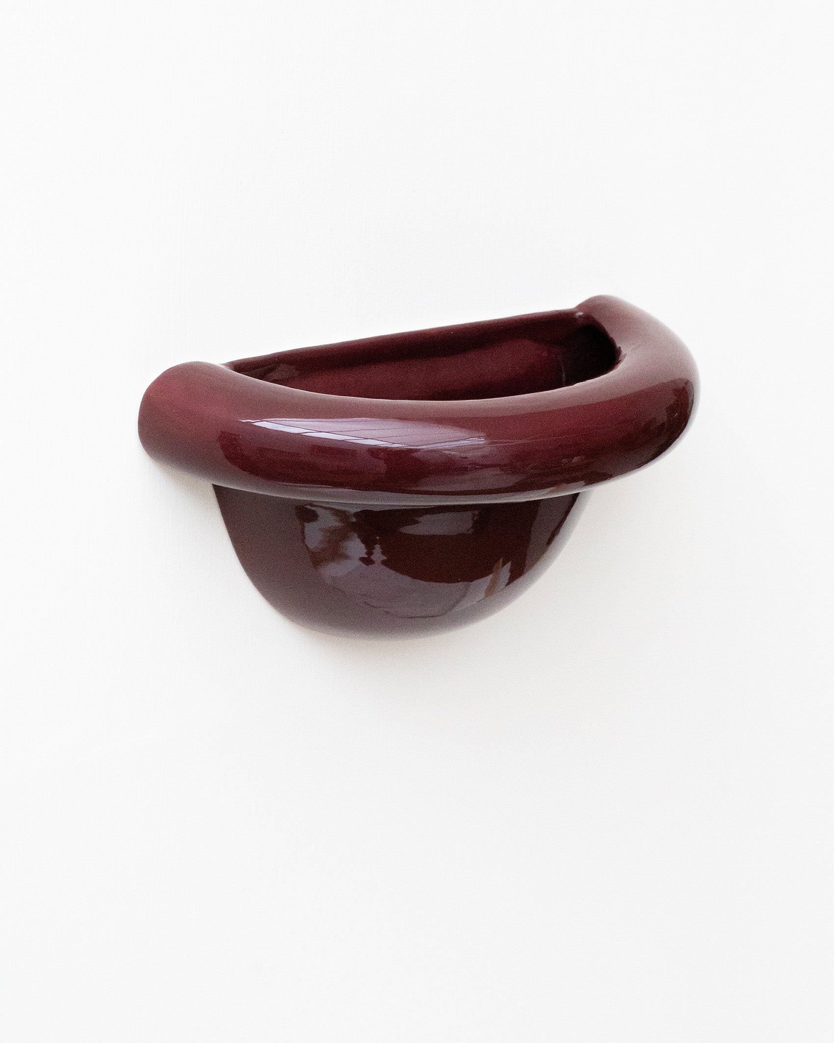 Late Afternoon Lighting Burgundy Uplighter Ceramic Sconce Wall Light on a white wall