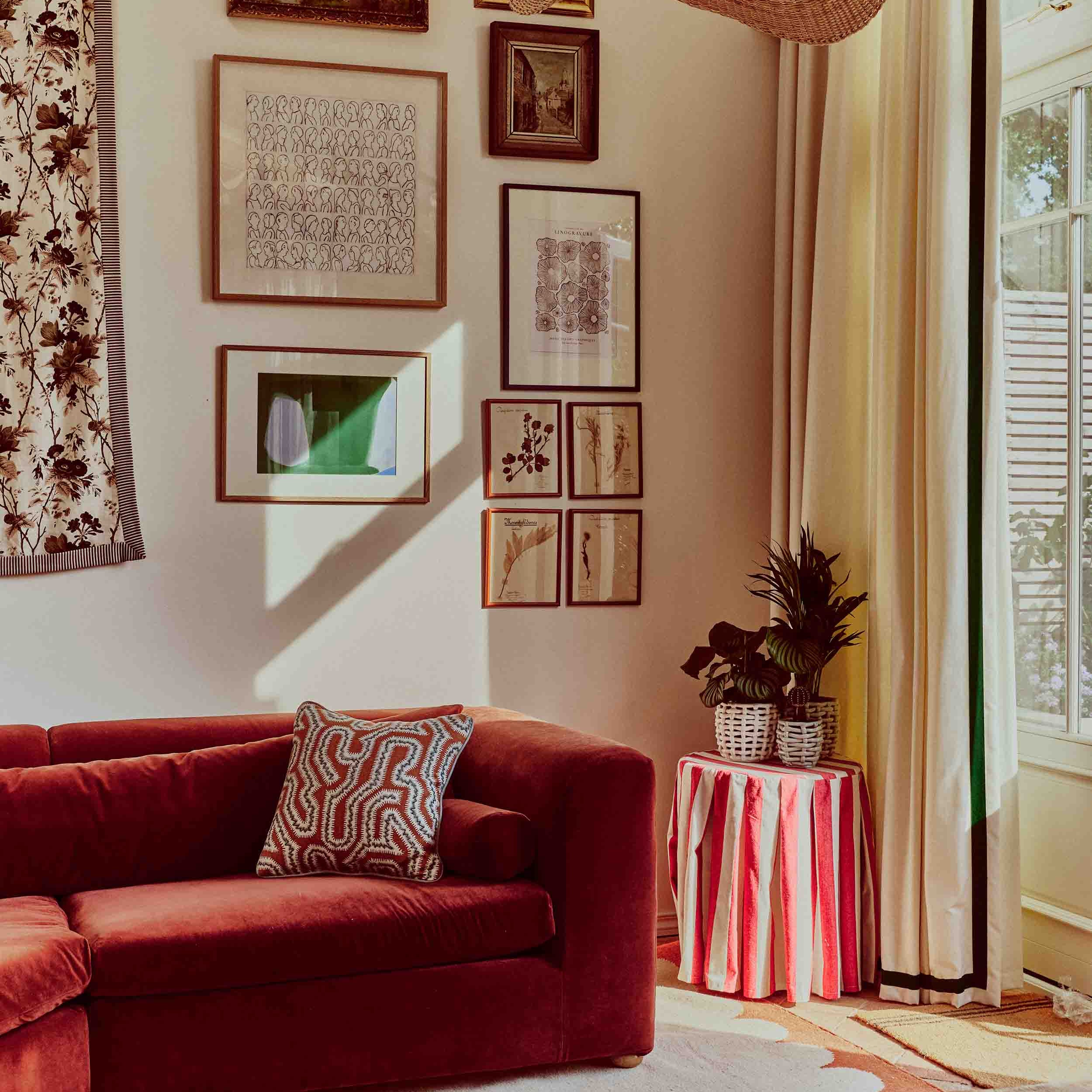 Late Afternoon Portico Rug in Rust with Burgundy Velvet Sofa
