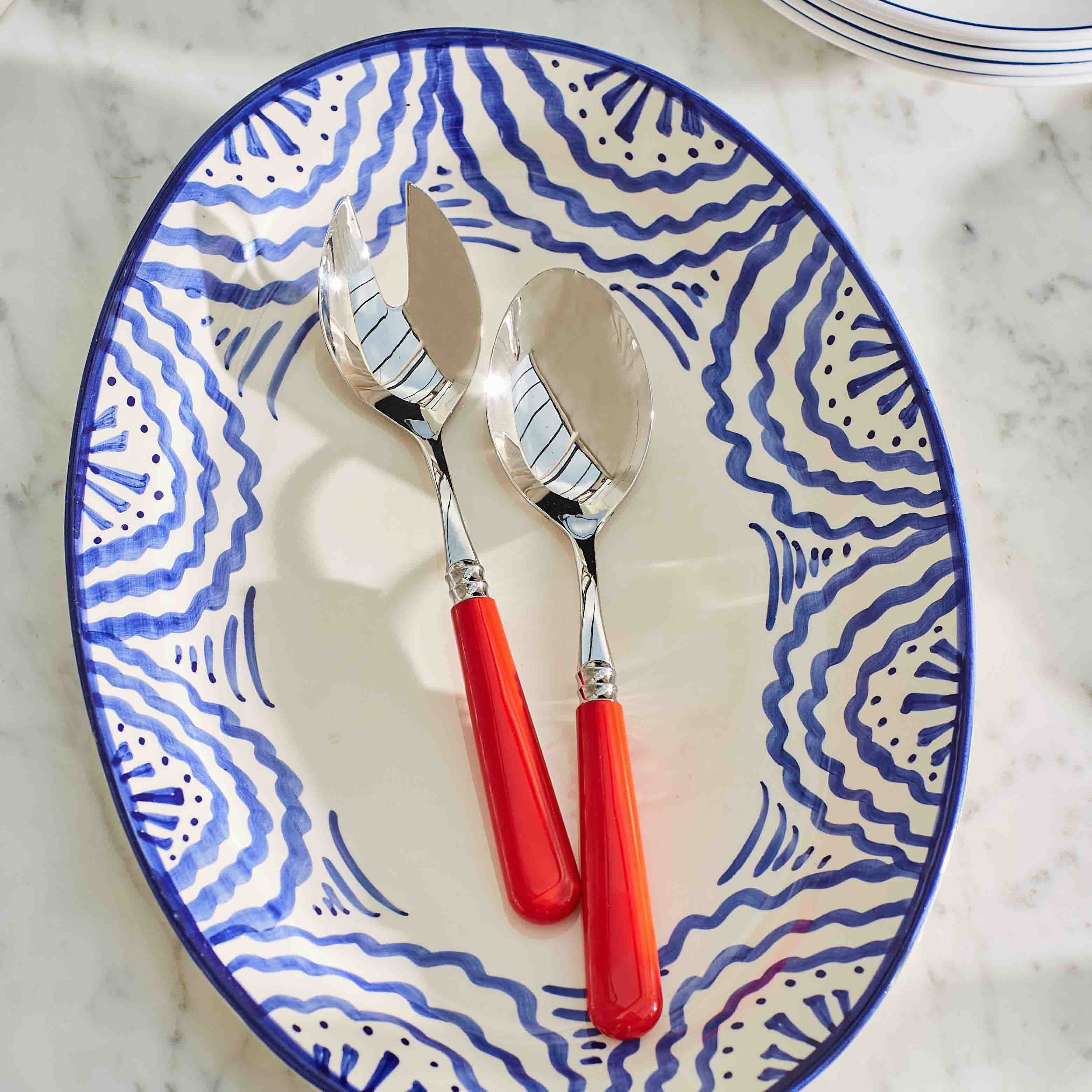 Salad Servers on Blue Platter